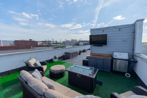 a view of a terrace with furniture