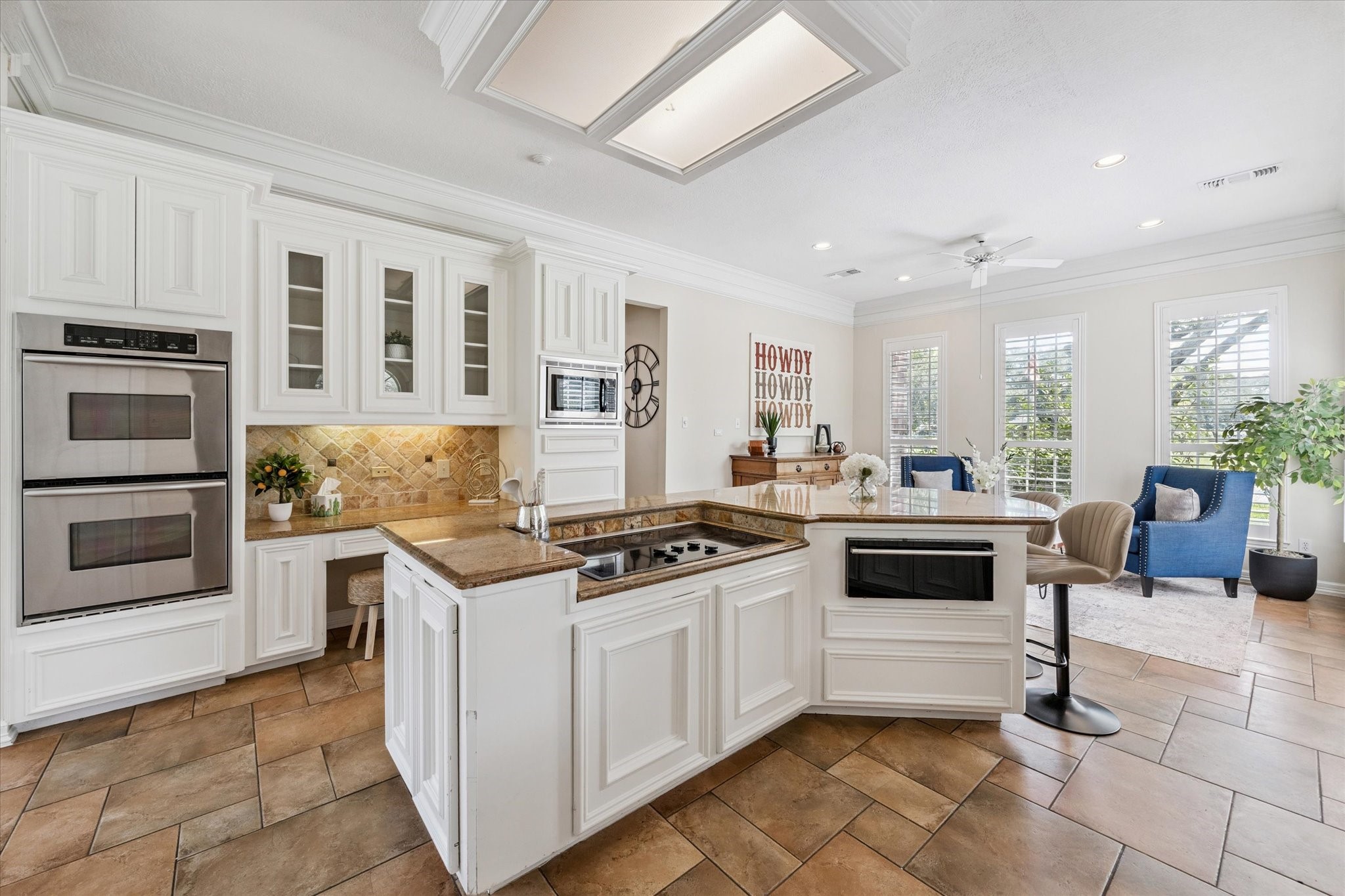 3577 Katy Hockley Road Katy, TX 77493 - Photo 22 of 50 a kitchen with granite countertop a stove top oven and cabinets
