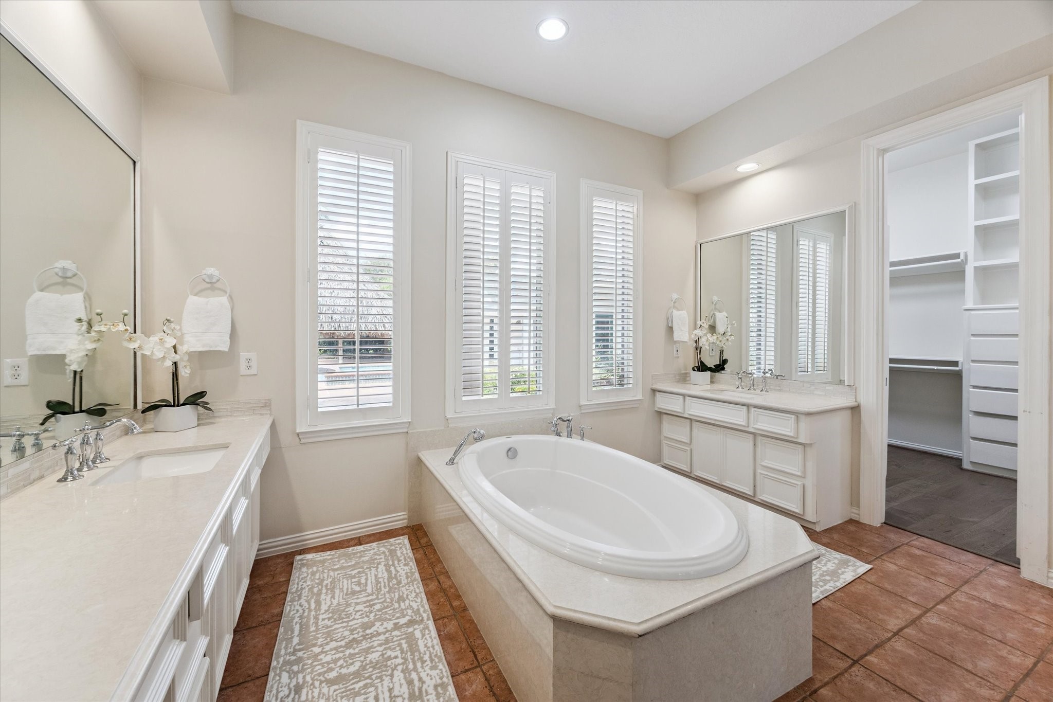 3577 Katy Hockley Road Katy, TX 77493 - Photo 26 of 50 a bathroom with a granite countertop sink mirror bathtub and shower
