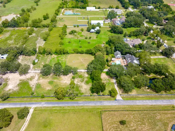 aerial view of a house with a yard