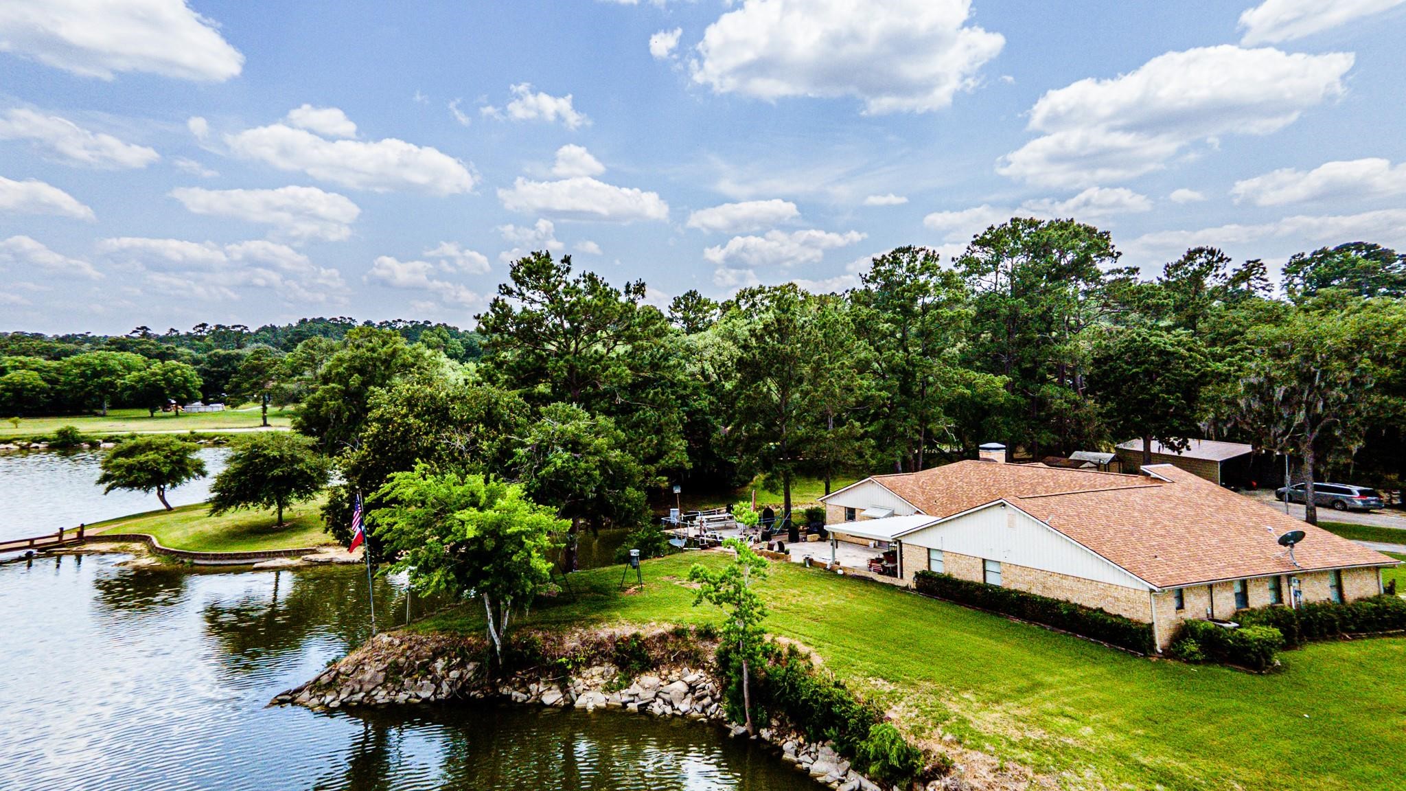 46 Point Loop Huntsville, TX 77320 - Photo 1 of 49 a view of a house with swimming pool and sitting area
