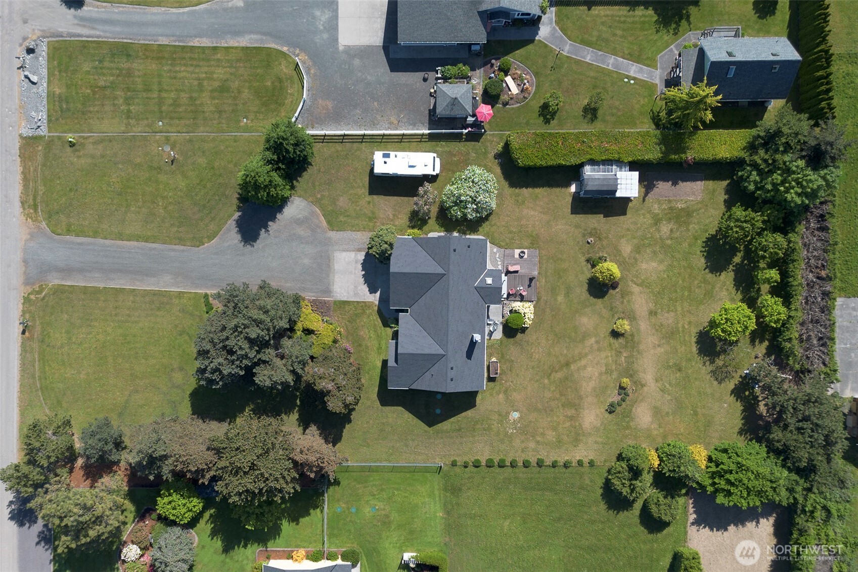 101 Timothy Lane Sequim, WA 98382 - Photo 36 of 39 an aerial view of a house with a garden and swimming pool