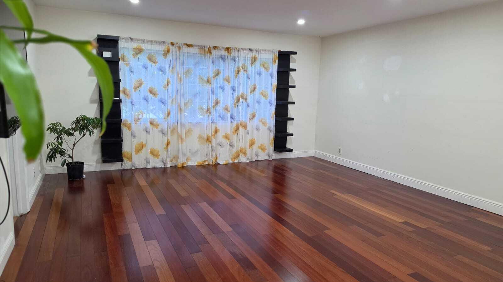 100 Ashbury Road, Unit 206 Hollywood, FL 33024 - Photo 13 of 23 a view of a room with wooden floor and a potted plant