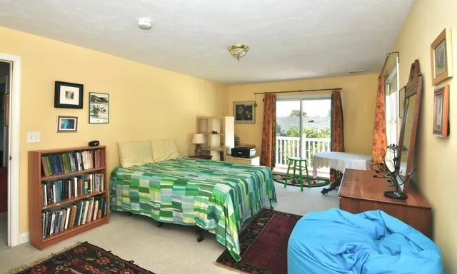 a bedroom with a bed furniture and a window