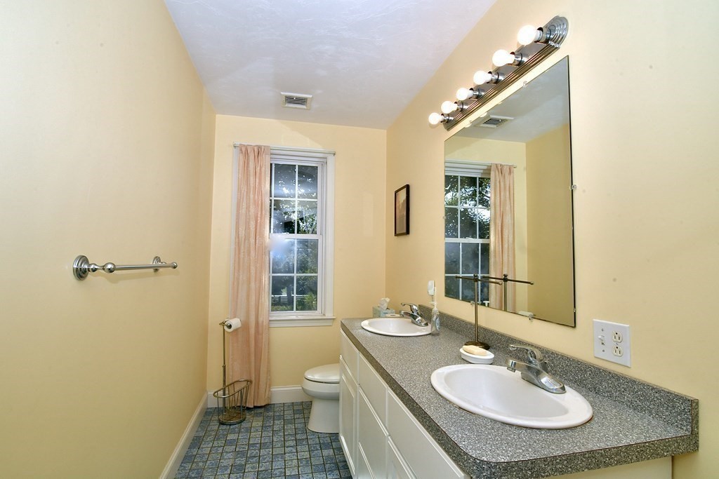 18 D Street Hull, MA 02045 - Photo 17 of 18 a bathroom with a sink and a mirror