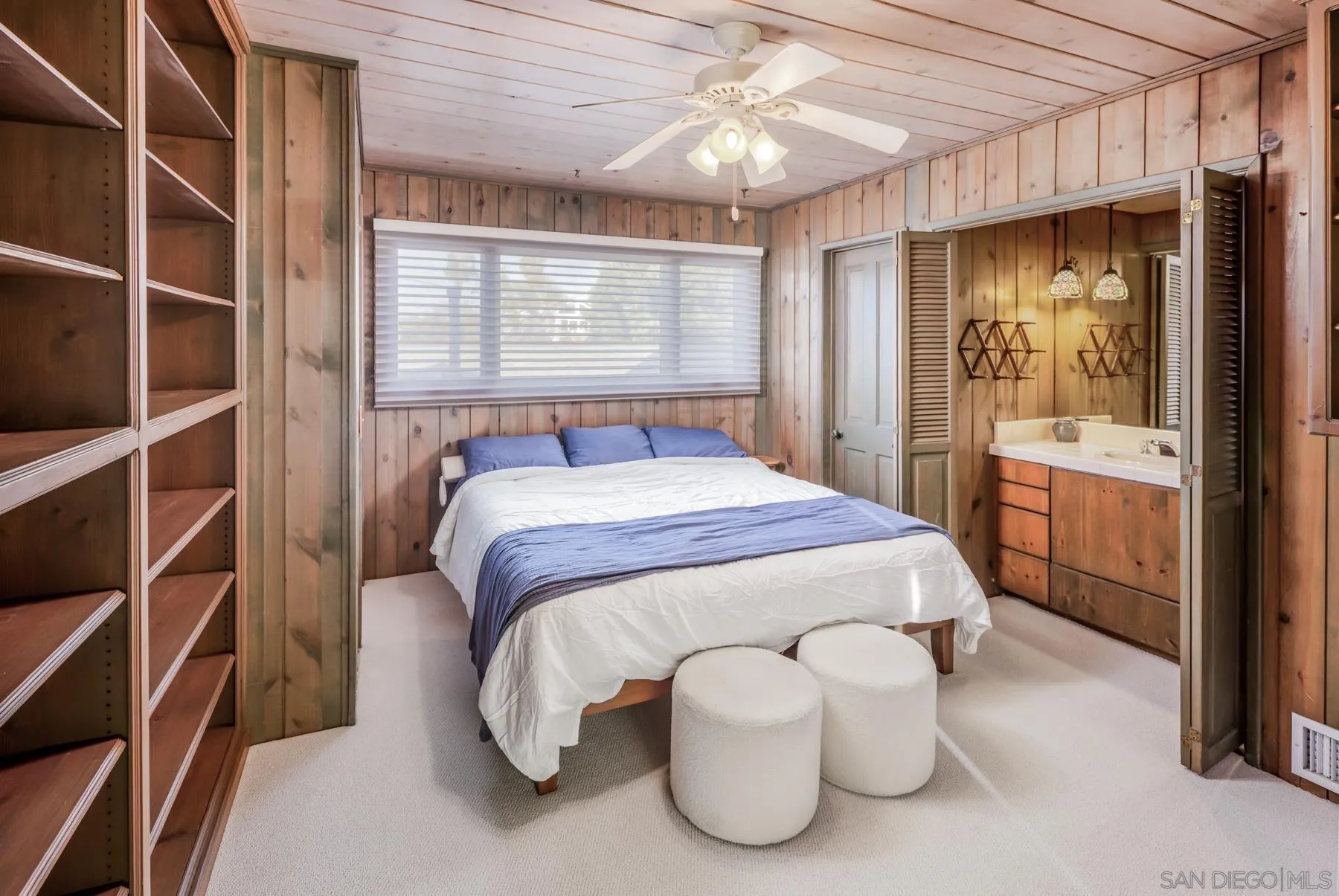 1036 Neptune Avenue Encinitas, CA 92024 - Photo 16 of 34 a bedroom with a bed and a window