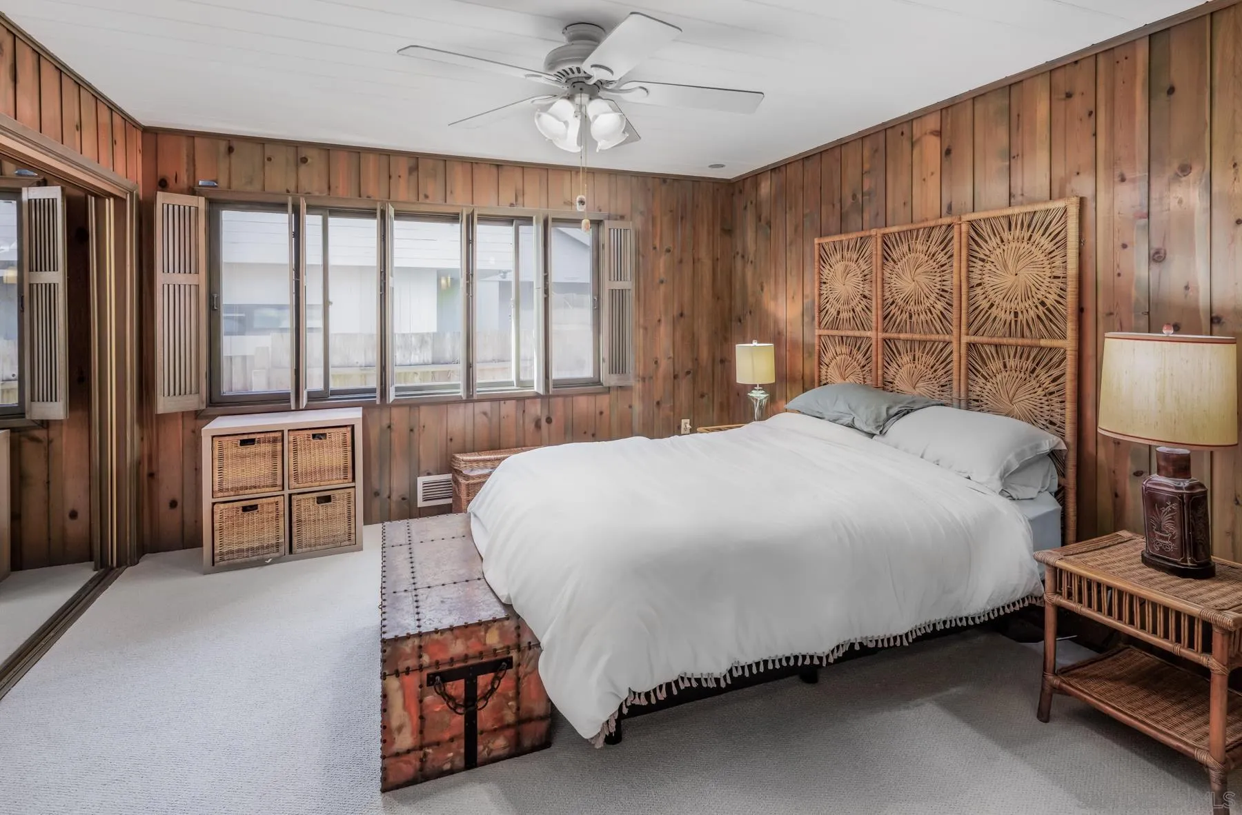1036 Neptune Avenue Encinitas, CA 92024 - Photo 17 of 34 a bedroom with a bed mirror and a large window
