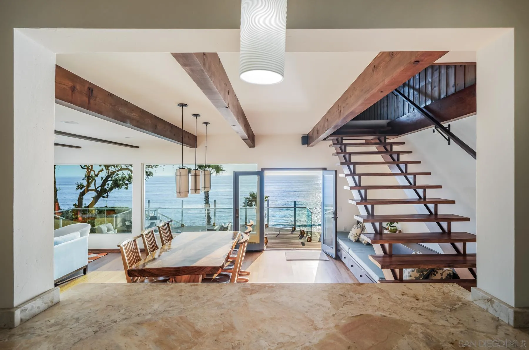 1036 Neptune Avenue Encinitas, CA 92024 - Photo 2 of 34 a living room with furniture a rug and white walls