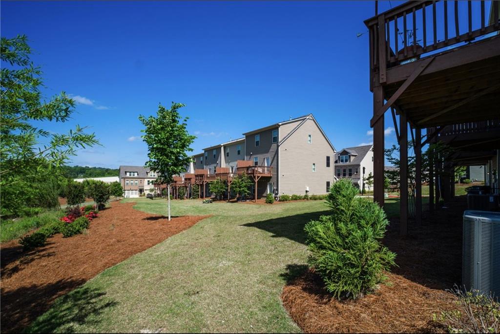 1595 Ridgebrook Downs Mableton, GA 30126 - Photo 33 of 39 a view of a house with backyard and garden