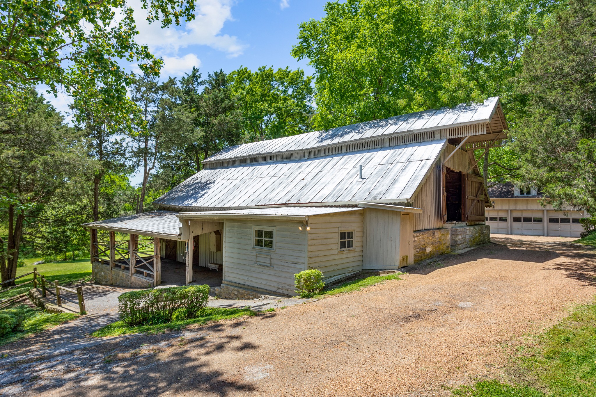 370 Vaughn Road Nashville, TN 37221 - Photo 14 of 27 a front view of a house with a garden