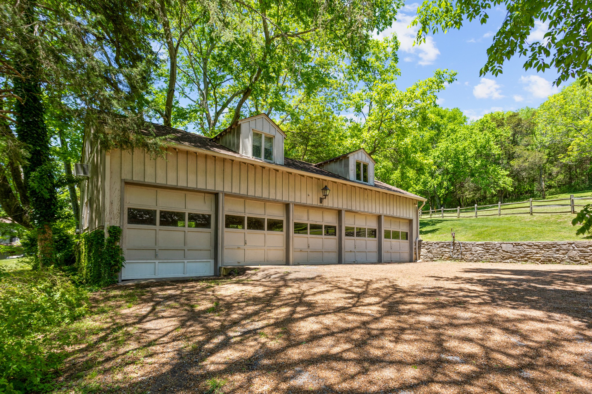 370 Vaughn Road Nashville, TN 37221 - Photo 17 of 27 a view of a house with a backyard and a garden