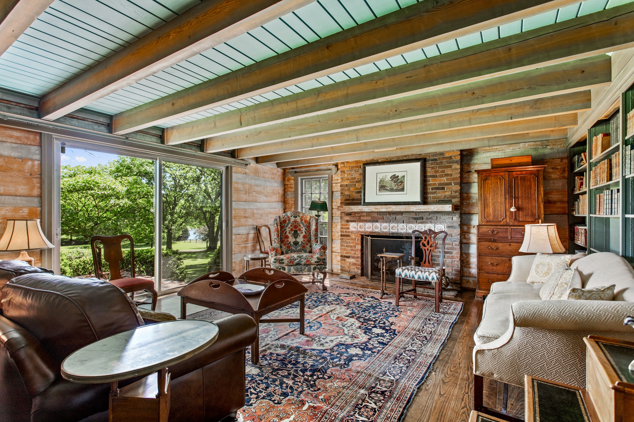 370 Vaughn Road Nashville, TN 37221 - Photo 7 of 27 a living room with furniture a fireplace and a table