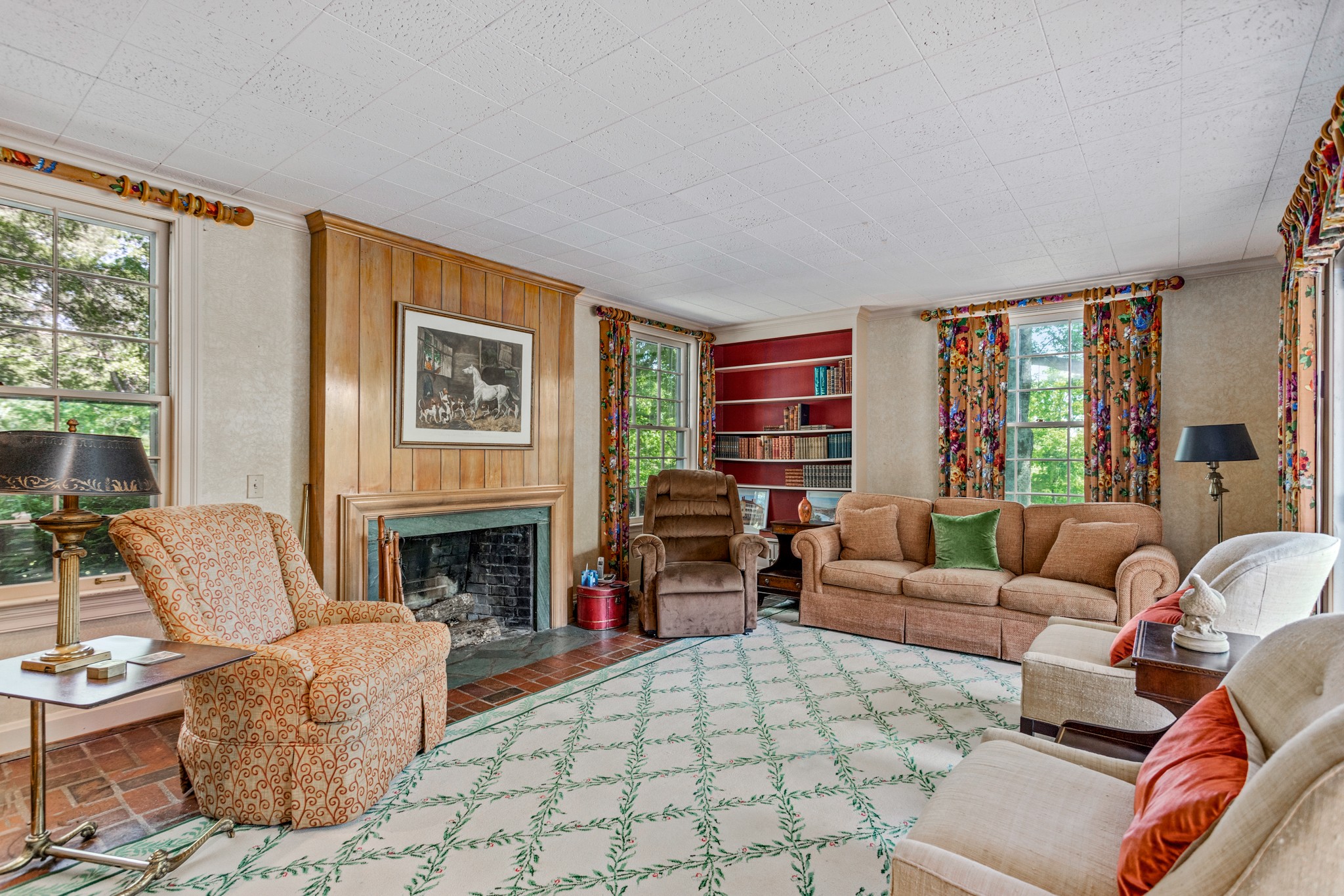 370 Vaughn Road Nashville, TN 37221 - Photo 10 of 27 a living room with furniture a fireplace and a large window