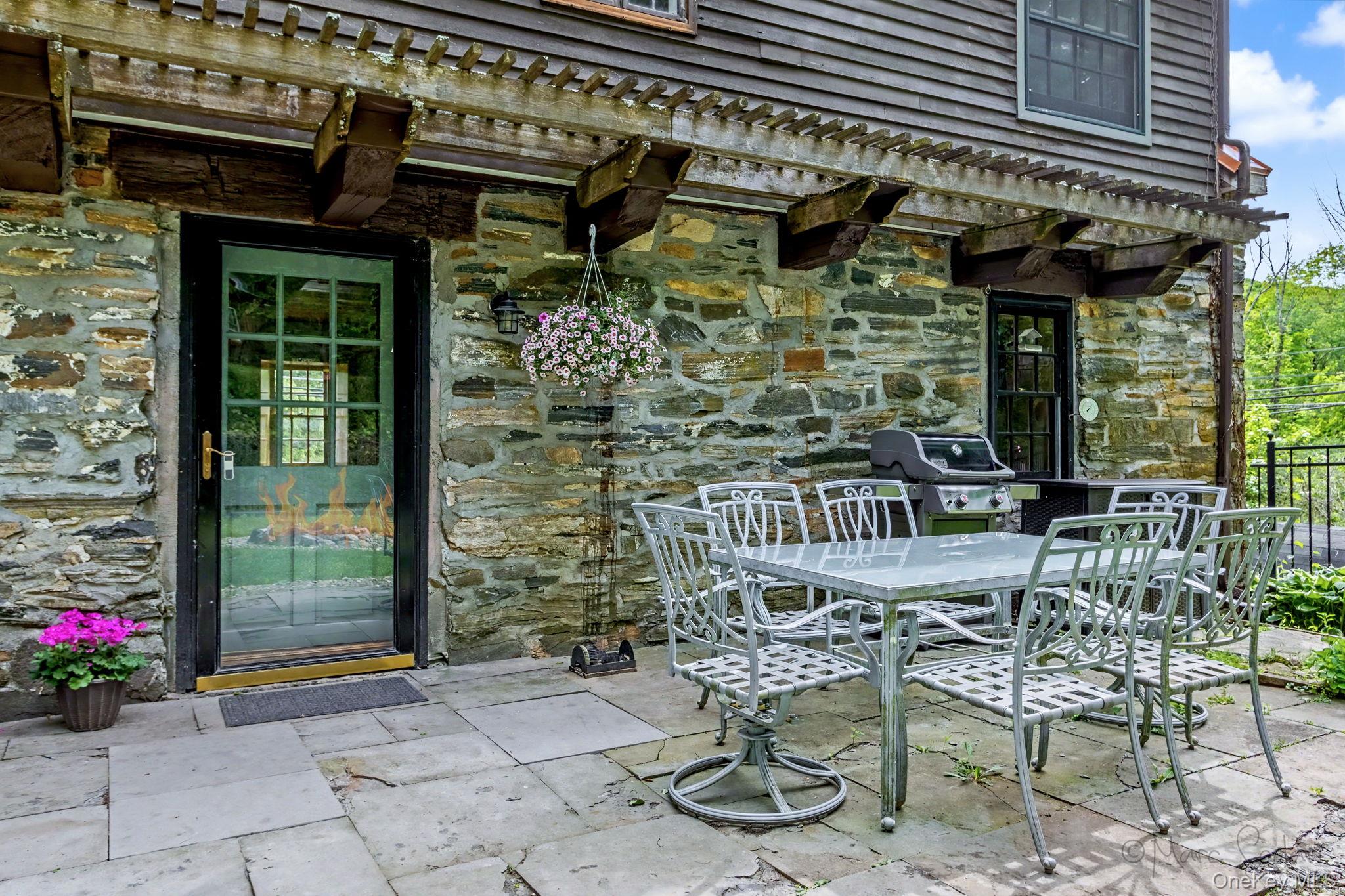 168 Old Rte 55 Pawling, NY 12564 - Photo 25 of 43 a table and chair sitting in front of a building