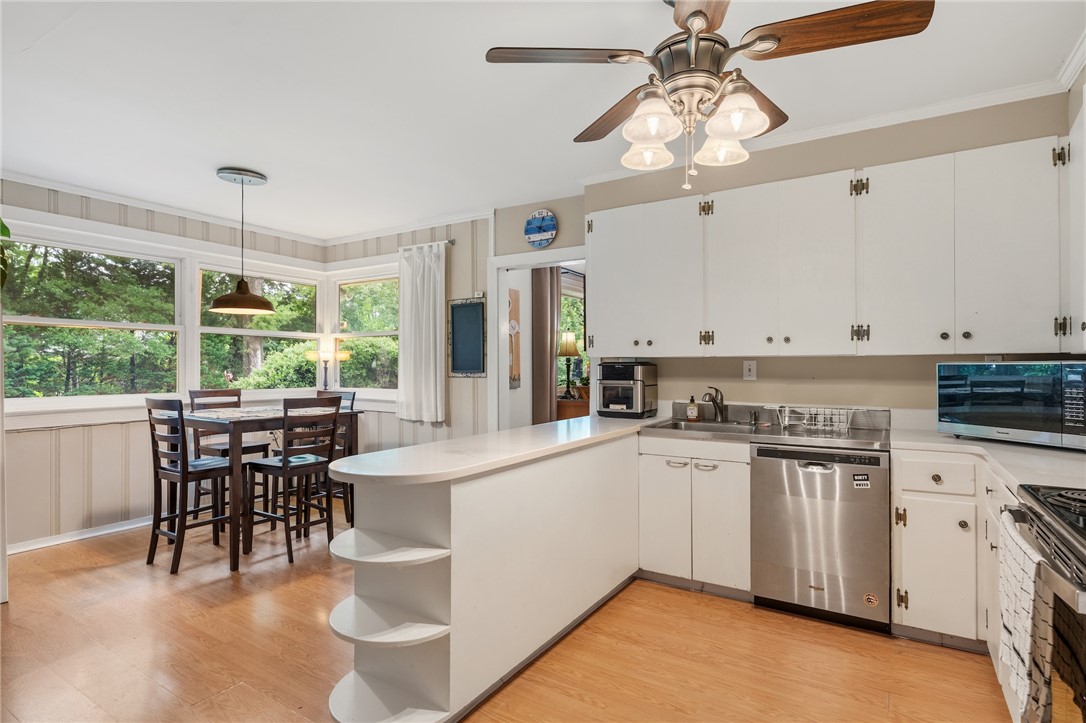 1105 Greenacres Anderson, SC 29621 - Photo 19 of 46 A warm kitchen with ample cabinet storage and an inviting eat-in area for casual meals.