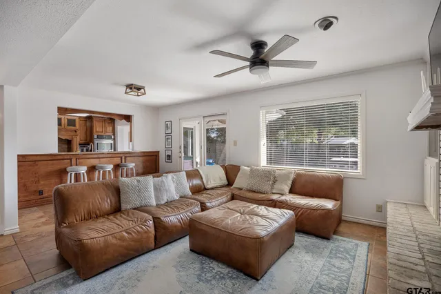 a living room with furniture and a window