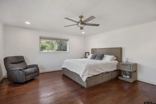 a spacious bedroom with a bed and a couch