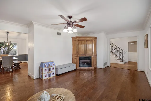 a view of livingroom with furniture fireplace and wooden floor