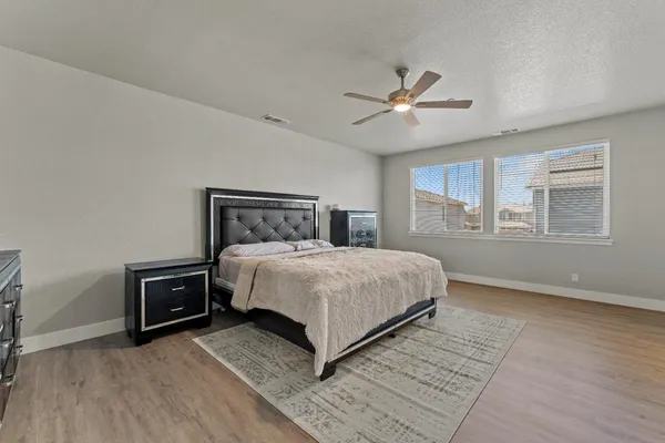 a bedroom with a bed and window