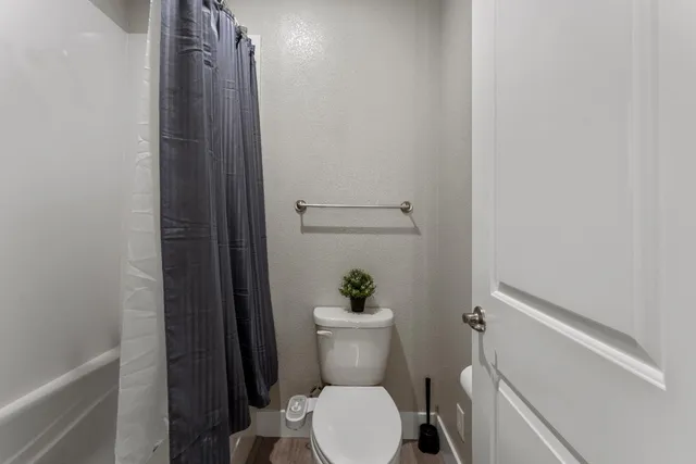 a bathroom with a toilet and a sink