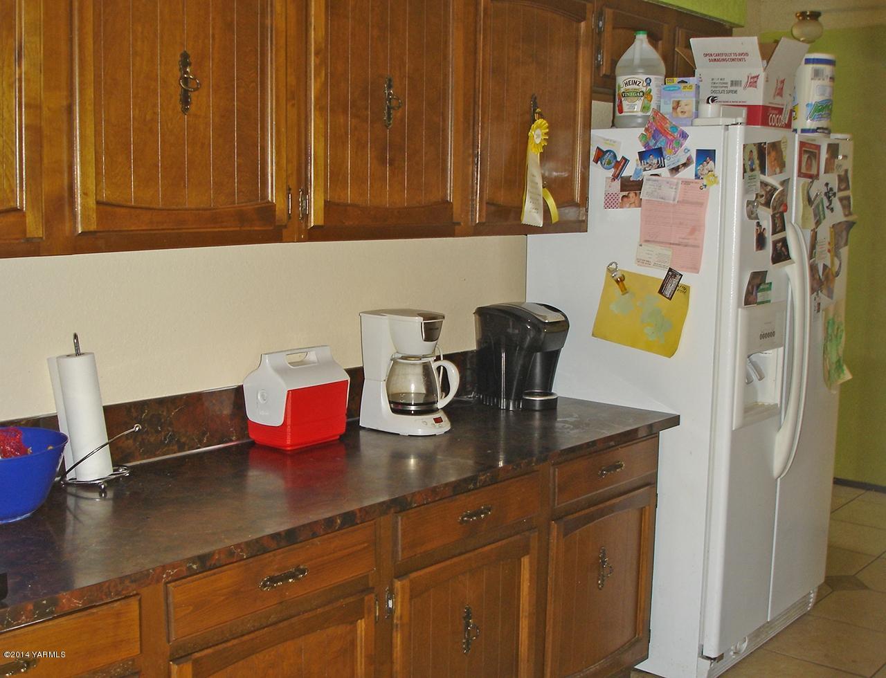 4650 Progressive Road Wapato, WA 98951 - Photo 5 of 12 a kitchen with a sink and cabinets