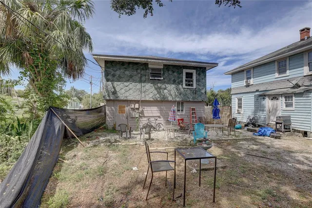 a view of house with chair and tables