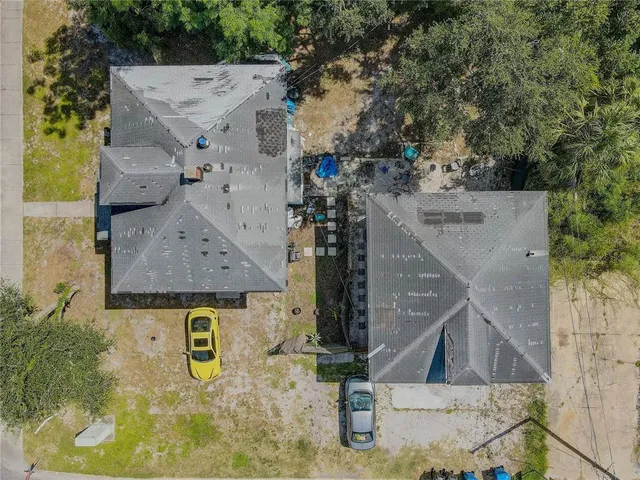 an aerial view of residential houses with outdoor space