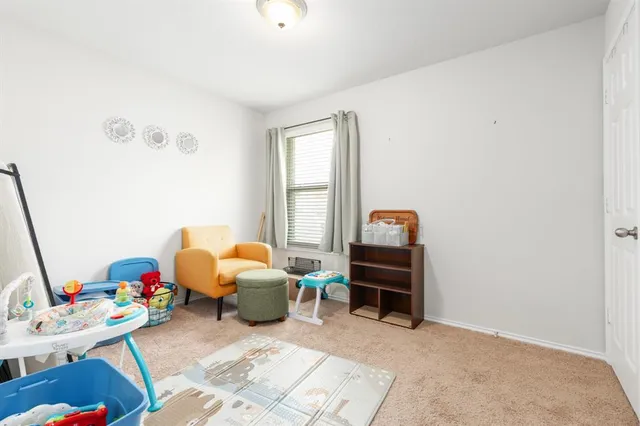 a bedroom with furniture and a window