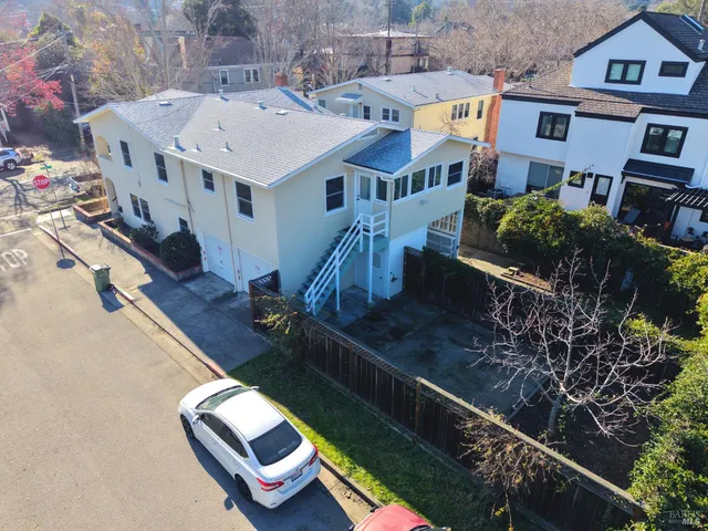 a aerial view of a house with swimming pool and porch