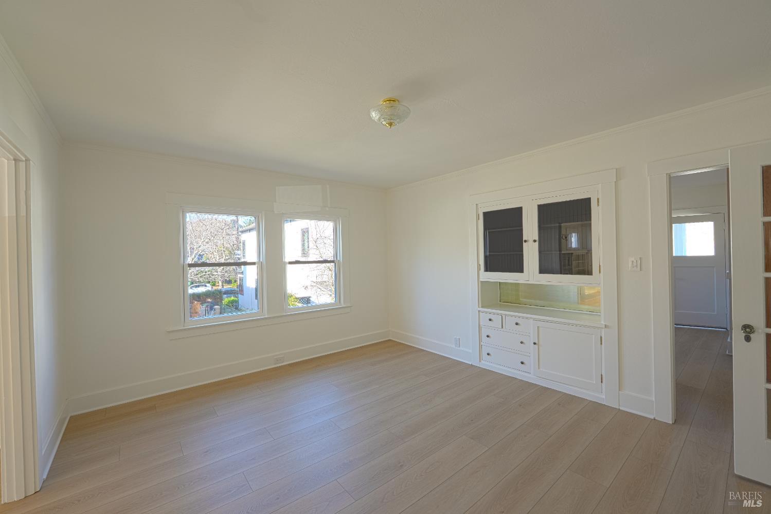 20 Taylor Street San Rafael, CA 94901 - Photo 11 of 22 an empty room with windows and cabinet