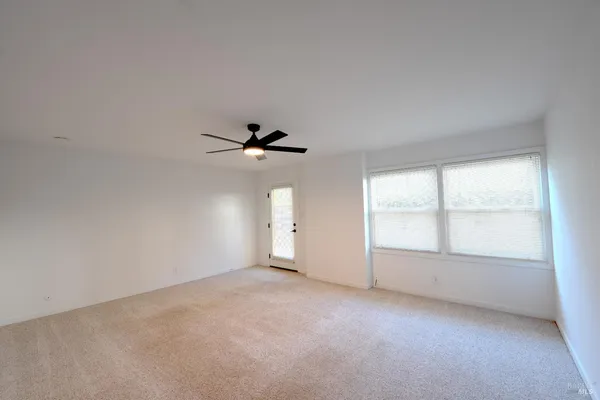a view of empty room with windows