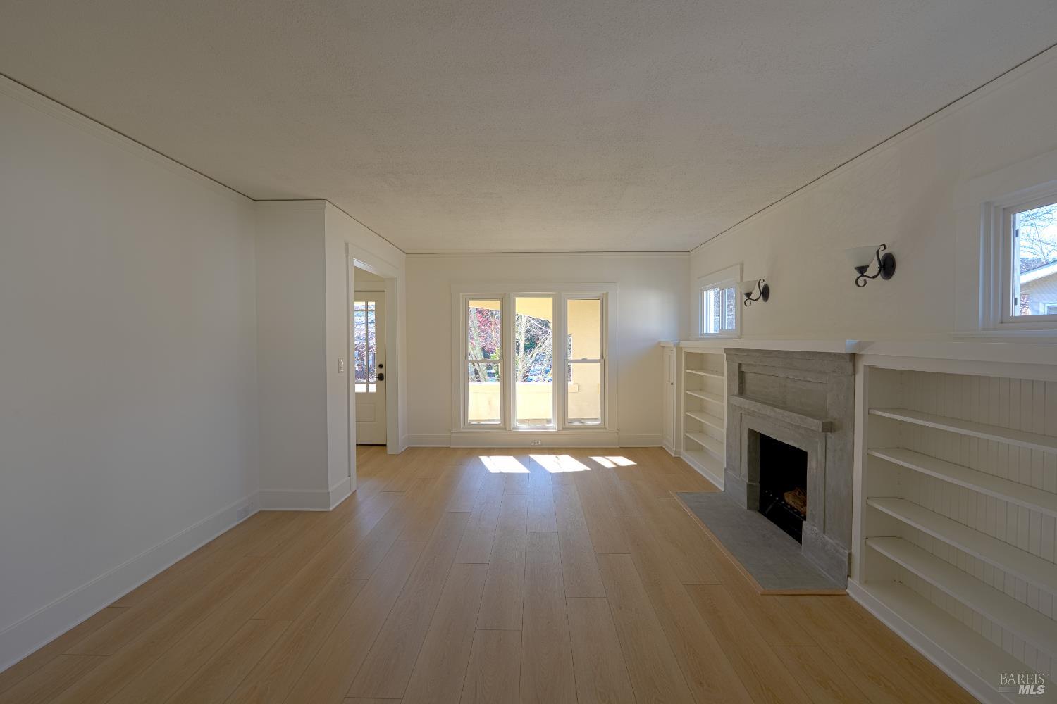 20 Taylor Street San Rafael, CA 94901 - Photo 6 of 22 a view of an empty room with a fireplace and a window