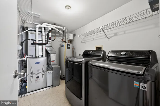 a view of a storage and utility room with racks on the wall