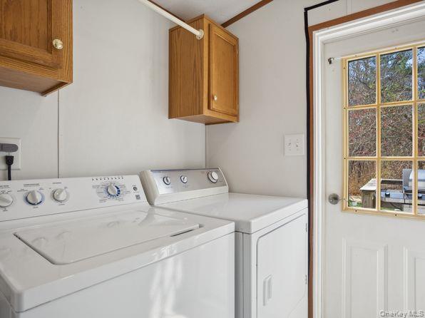 337 Three Mile Harbor Road, Unit 10 East Hampton, NY 11937 - Photo 12 of 16 a utility room with dryer and washer