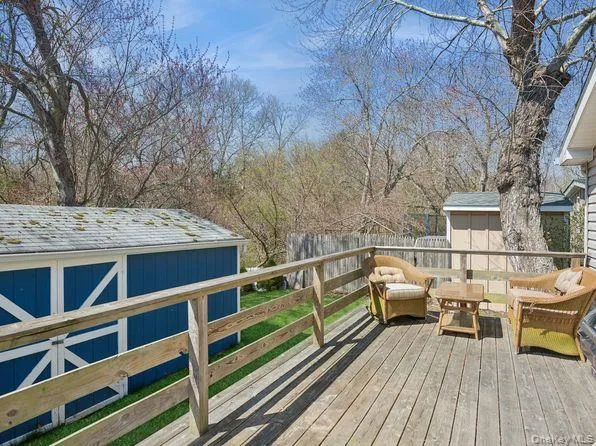 a view of a balcony with chairs