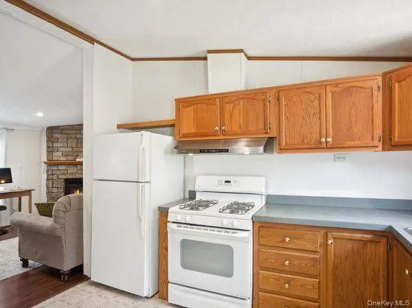 a kitchen with stainless steel appliances granite countertop a refrigerator sink and cabinets