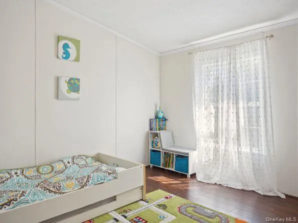 a bedroom with a bed and a window in it