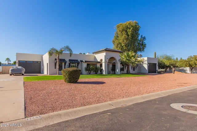 a view of swimming pool with a house in the background
