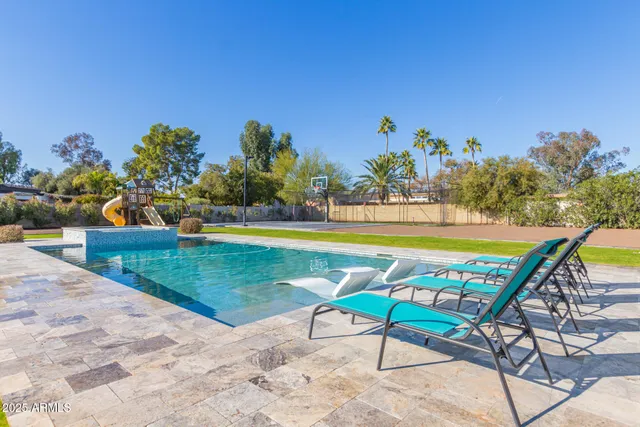 a view of a chairs and table in the patio