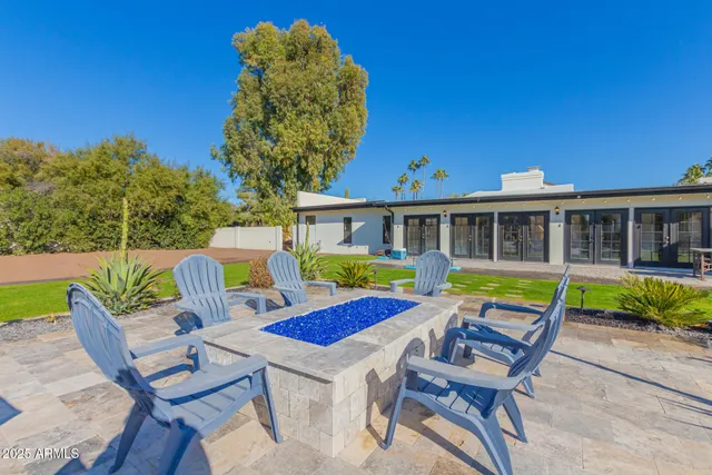 a view of a swimming pool and a yard
