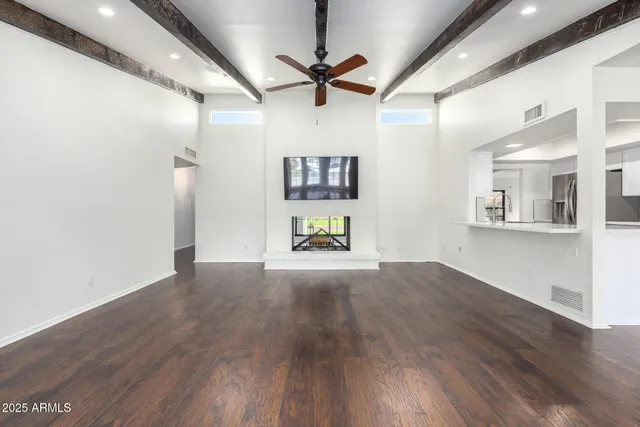 a view of a livingroom with wooden floor