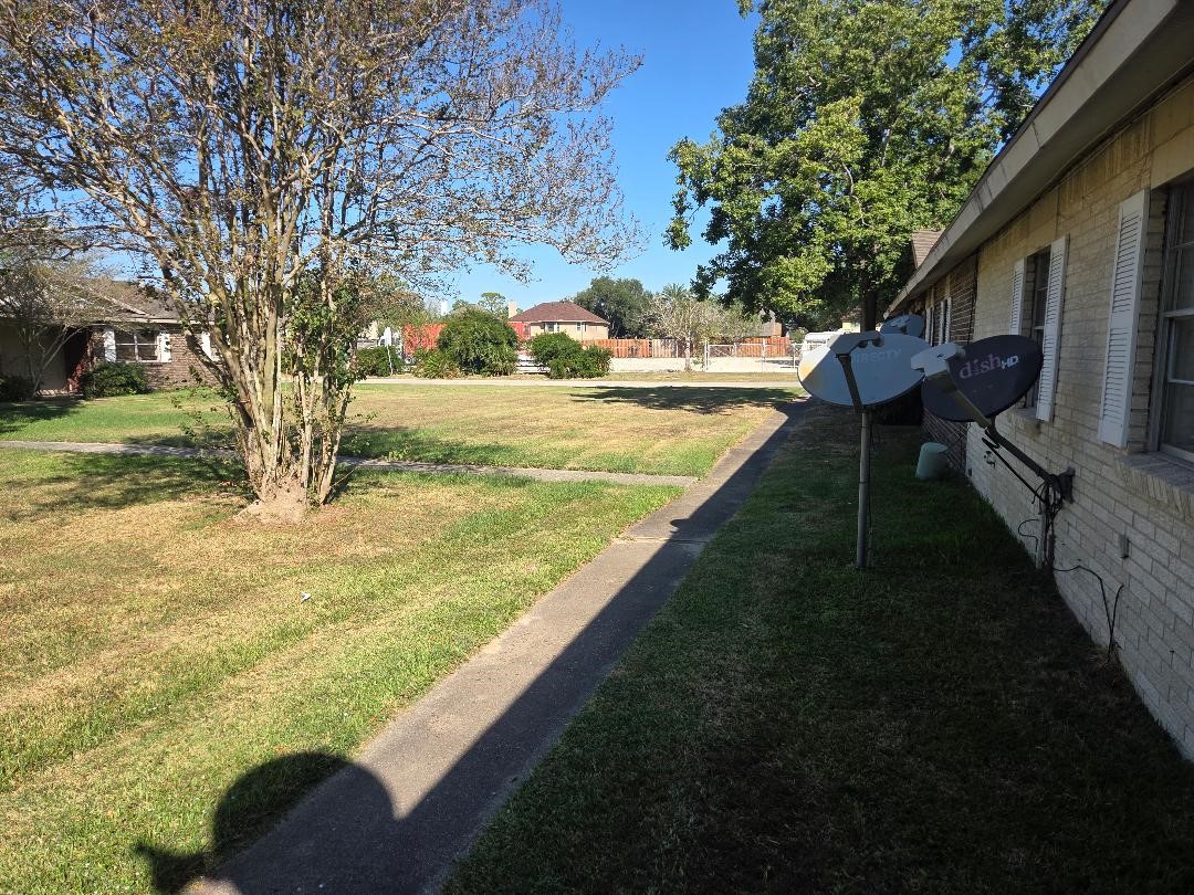 a view of swimming pool with an outdoor seating