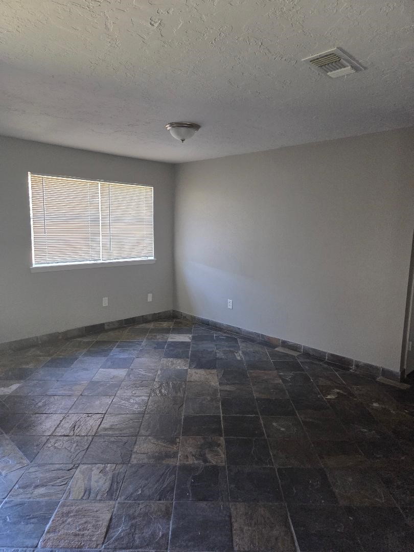 2000 Bahama Drive, Unit 30 Seabrook, TX 77586 - Photo 9 of 14 an empty room with a empty space and window