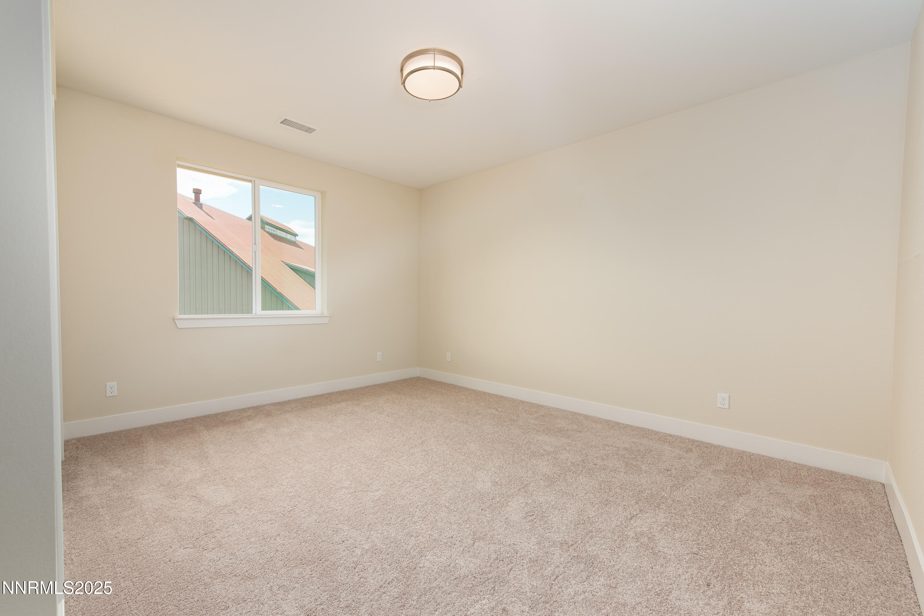 692 Sage Grouse Loop Gardnerville, NV 89460 - Photo 25 of 36 an empty room with a window
