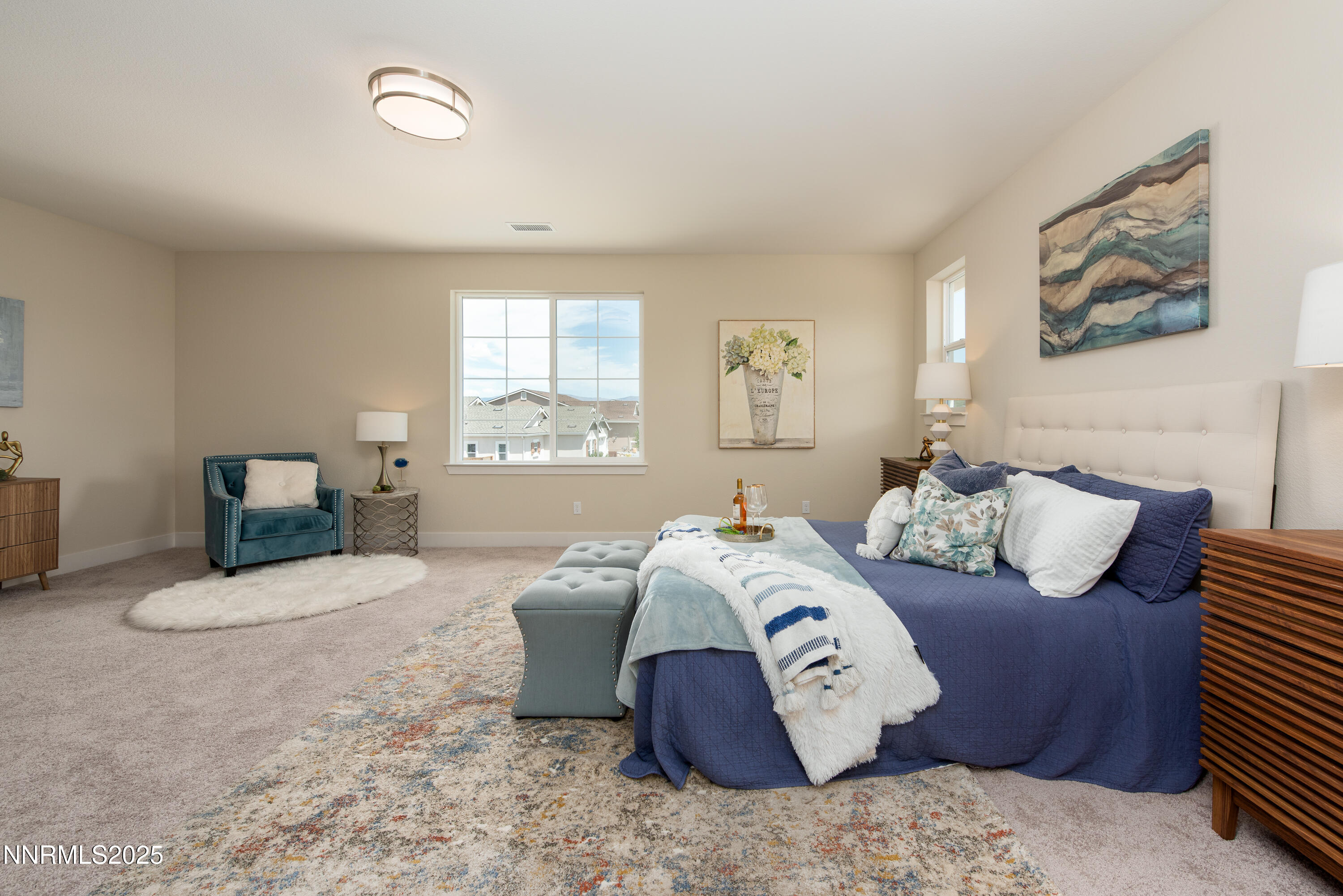 692 Sage Grouse Loop Gardnerville, NV 89460 - Photo 3 of 36 a bedroom with bed and a couch