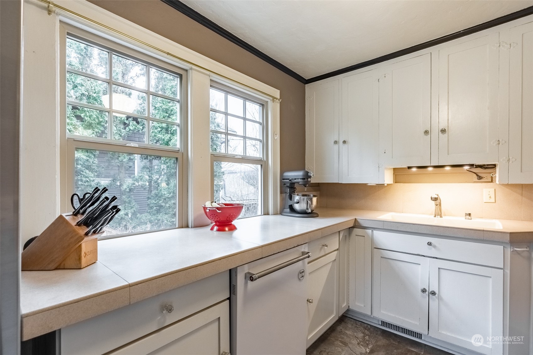 2212 Broadway Bellingham, WA 98225 - Photo 14 of 40 a kitchen with a sink cabinets and window