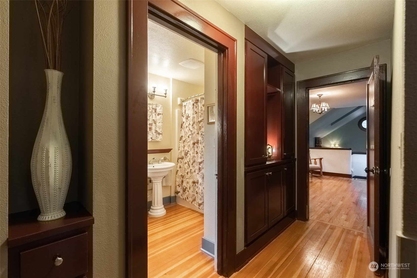 2212 Broadway Bellingham, WA 98225 - Photo 19 of 40 a view of a hallway with wooden floor and a bathroom