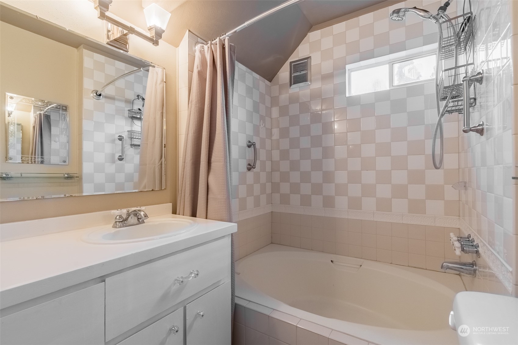 2212 Broadway Bellingham, WA 98225 - Photo 25 of 40 a bathroom with a granite countertop sink a toilet and shower