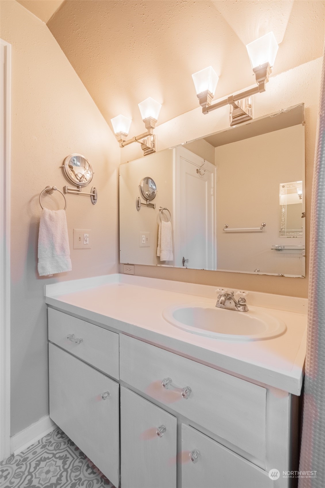 2212 Broadway Bellingham, WA 98225 - Photo 26 of 40 a bathroom with a sink and a mirror