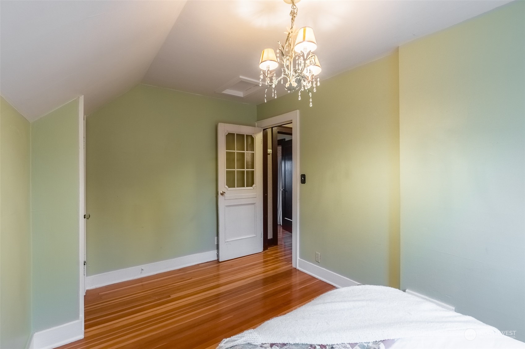 2212 Broadway Bellingham, WA 98225 - Photo 28 of 40 a view of a room with wooden floor and chandelier